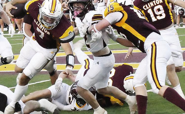 Clinton’s No. 15 Gavin Evans, right, blocks for No. 7 Easten Powell, as he carries the ball against Blanchard Friday in the Red Tornadoes’ home-opening win. CDN | John Kinsey