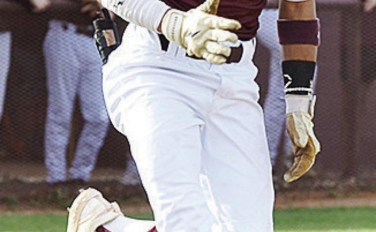 No. 5 Jesus Gutierrez hustles down the first base line as he safely gets on base during Clinton’s game against Leedey. CDN | Sam Goodwyn