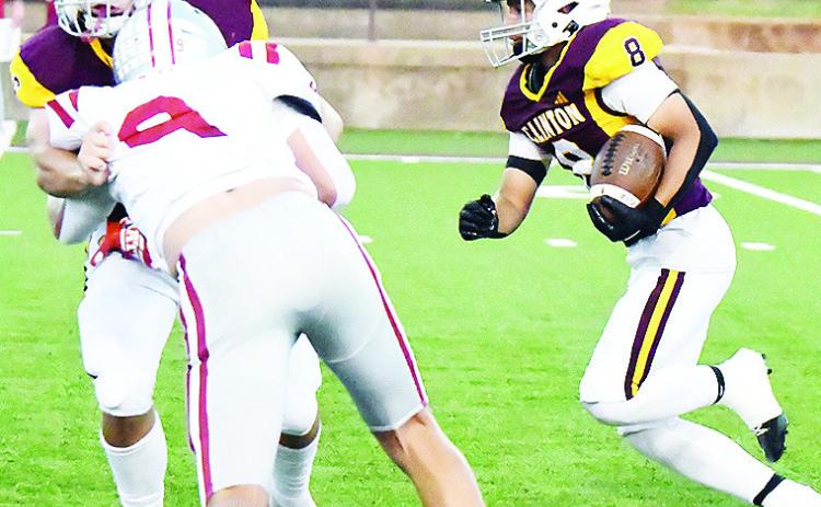 Clinton’s Benton Bridgeman, left, blocks Weatherford’s Kalen Clift, as No. 8 Jaden Potter hustles through with the ball during the Red Tornadoes’ win in the “Custer County Conflict” Friday in the Tornado Bowl. CDN | John Kinsey