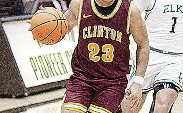 Clinton’s Easten Powell takes the ball up the court during the Reds’ road game against Elk City. CDN | Sam Goodwyn