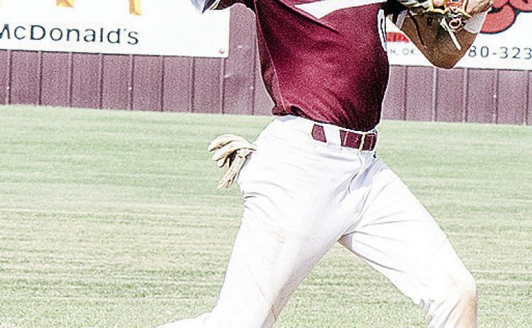 Clinton’s Declan Brown hurls the ball toward first for the out during the Reds’ summer game against Weatherford. CDN | Sam Goodwyn