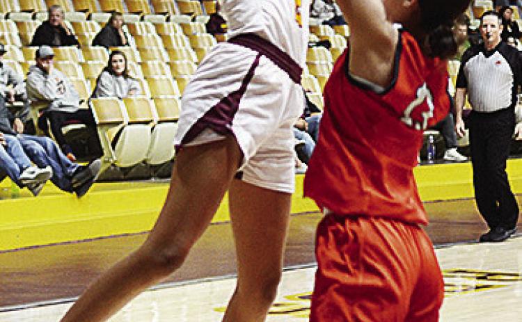 Lady Reds’ Ella Redshin shoots over a Lindsay defender during Clinton’s home game against the Leopardettes. CDN | Sam Goodwyn