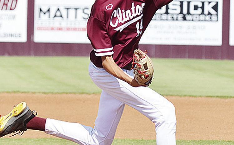 Clinton’s Conner Meget pitches the ball during the Reds’ home game Tuesday against the Canute Trojans. CDN | Sam Goodwyn