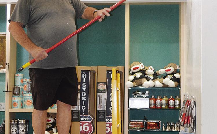 Jim Littke applies a fresh coat of paint to the gift shop area Thursday at the Oklahoma Route 66 Museum. CDN | Christian Jacobsen