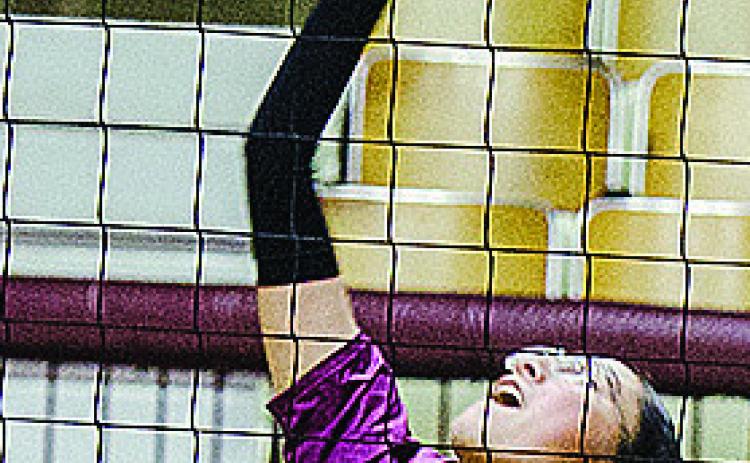 No. 13 Karely Aguilar hits the ball over the net during Clinton’s game against Sante Fe South. CDN | Sam Goodwyn