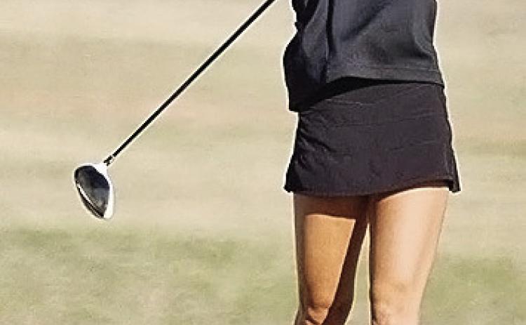 Addison Newcomb stares at the ball after hitting it during a tournament this last season. CDN | Sam Goodwyn