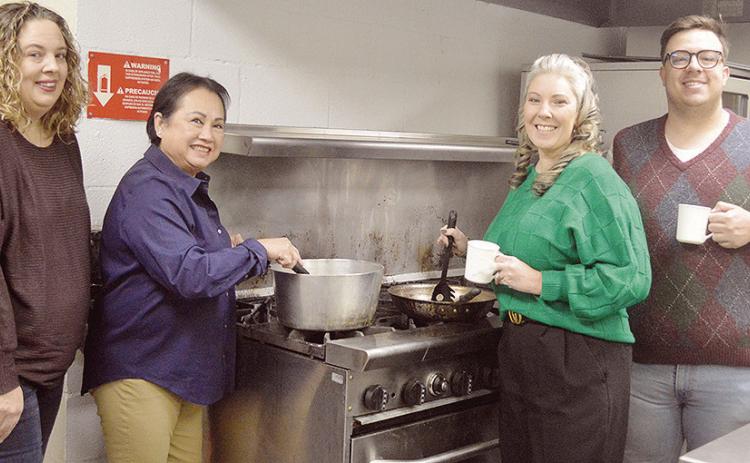 From left, Clinton Rotary Club President Natalie Simpson, and fellow Rotarians Hoi Geswender, Carolyn Heerwald, and Conner Kirk bring the spice to the Frisco Center kitchen ahead of the Rotary Club Chili Day and Silent Auction tomorrow. CDN | Micah Ashcra