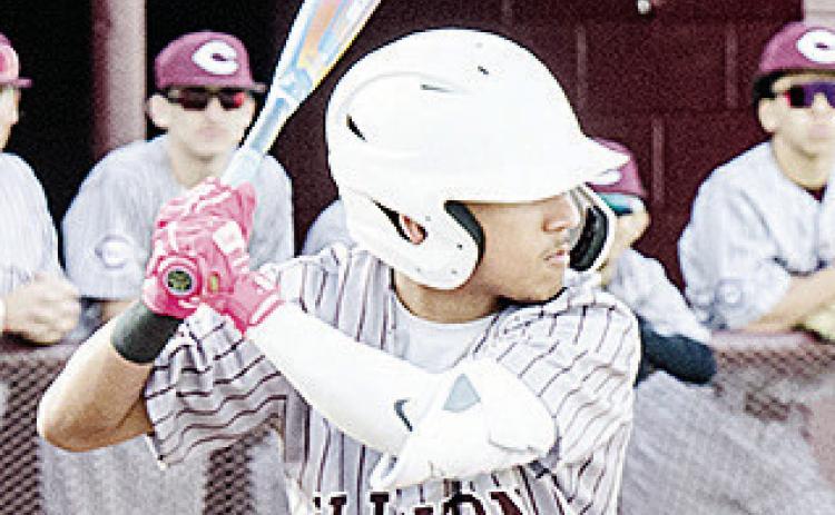 Clinton’s Azreal Fierros stares down the pitcher during the Reds’ win over Western Heights. CDN | Sam Goodwyn