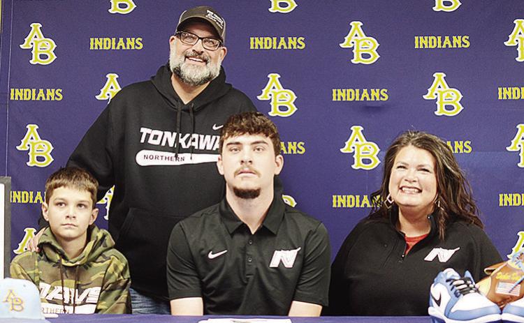 Arapaho-Butler’s Decker Davis, center, sits with his brother Slade, left, mom Diana, right, and dad Jake, standing, after he signs with Northern Oklahoma College to play baseball. CDN | Sam Goodwyn