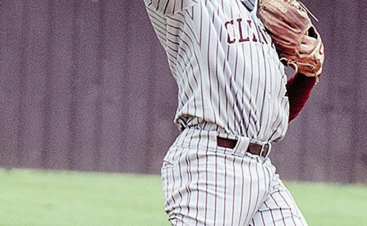 Clinton’s Easten Powell tosses the ball to the pitcher during the Reds’ home game Friday against the Kingfisher Yellowjackets. CDN | Sam Goodwyn