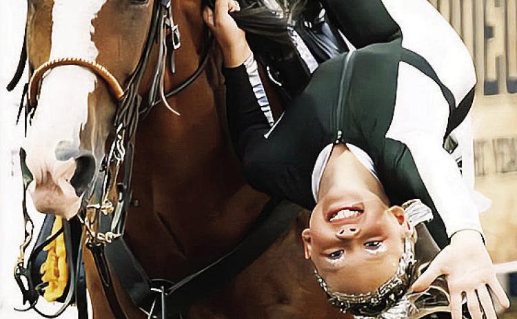 Emma Townsley performs a trick on her horse during the rodeo last year at the Clinton Roundup Club Areana. CDN | Courtesy photo