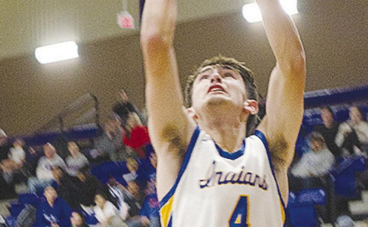 No. 4 Kaden Waldrop fights through a defender for the layup in A-B’s game against Hammon. CDN | Sam Goodwyn