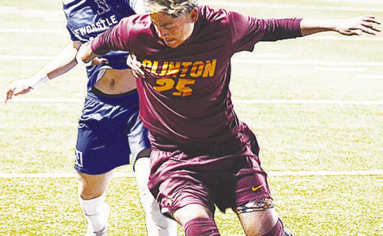 Clinton’s No. 25 Andrew Barron fights with a Newcastle player for control of the ball during the Reds’ 1-0 victory Tuesday over the Racers in the Tornado Bowl. CDN | Sam Goodwyn