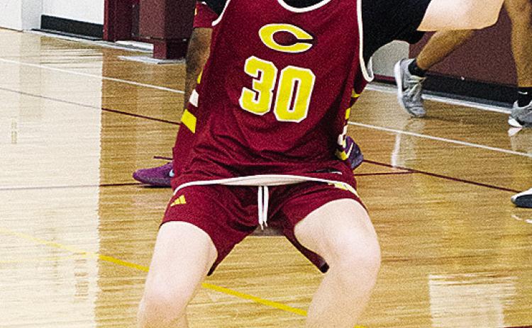 Axl Deatherage works on his defensive skills during basketball practice Wednesday in the practice gym. CDN | Sam Goodwyn