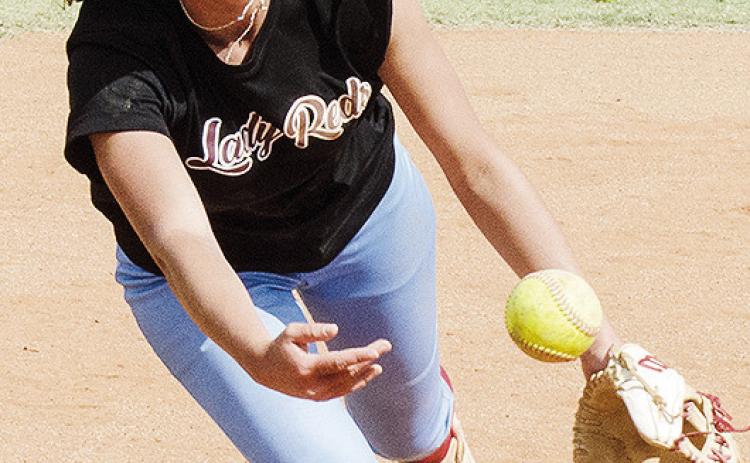 Clinton’s Reese Giblet flips the ball to third for the out during a softball practice this season. CDN | Sam Goodwyn