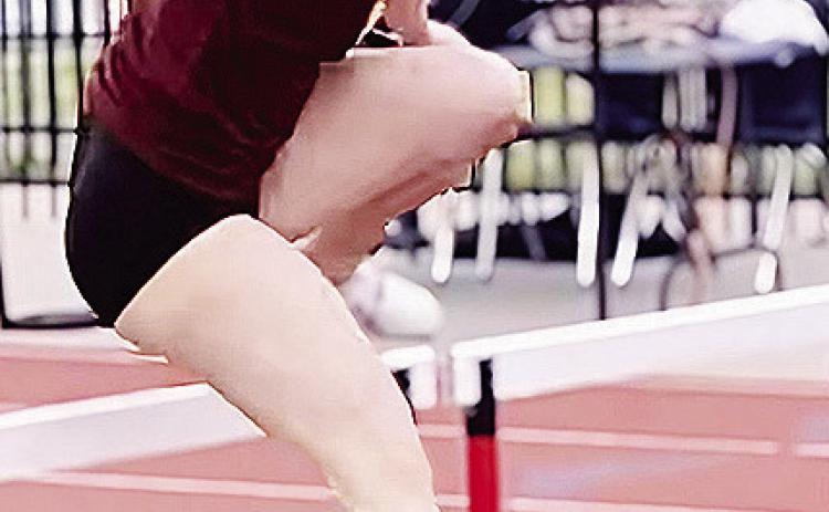 Presley Evans jumps over a hurdle during the meet in Elgin. CDN | Courtesy photo