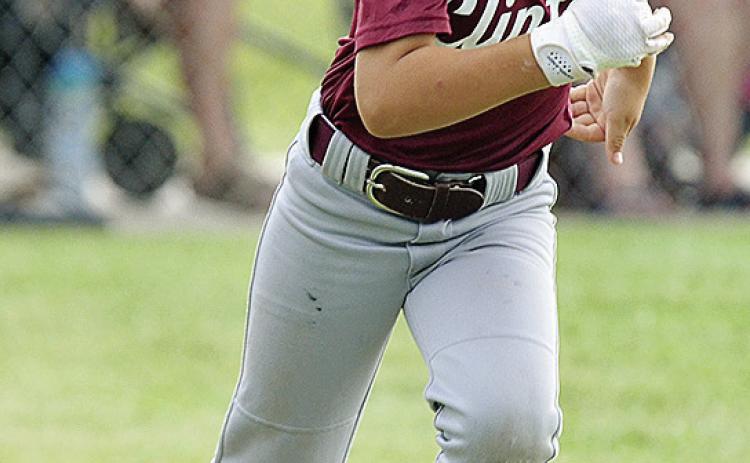 Ayden Taylor hustles to first during the Clinton Maroons’ game in the OK Kids 8U State Baseball Tournament at Schumacher Fields at Acme Brick Park. CDN | Sam Goodwyn