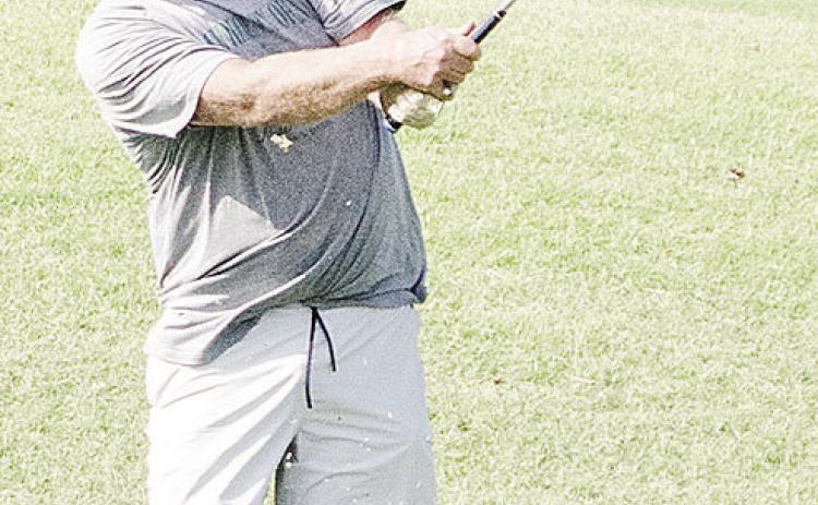 Wade Cummins watches the ball fly after driving it far during a round of golf at Riverside. CDN | Sam Goodwyn