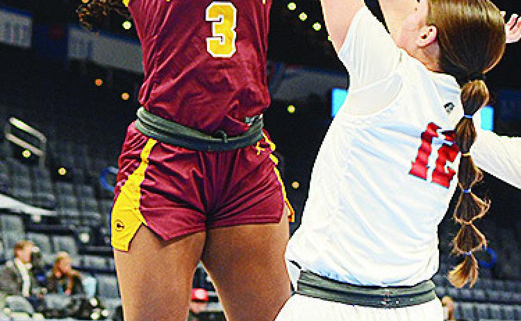 Clinton’s Arlena Kirkendoll shoots the ball over a Cache defender during the Lady Reds’ come-from-behind win over the Lady Bulldogs. CDN | Sam Goodwyn