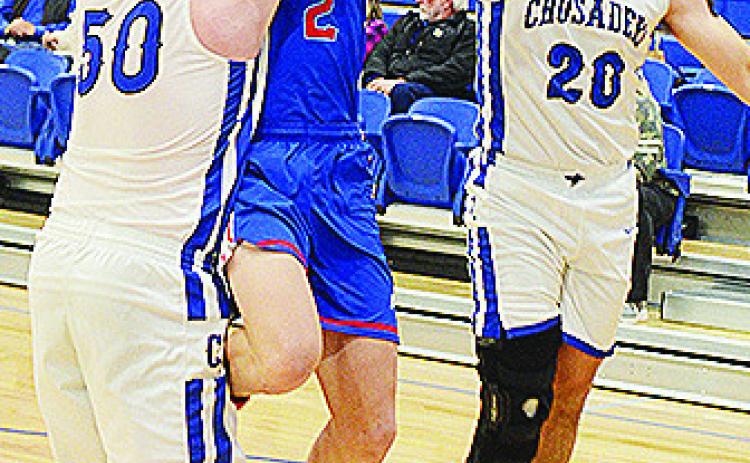 No. 50 Cruze Bittle and No. 20 Zach Zyback come together to help stop the Bray-Doyle player during CBA’s first-round win over the Donkeys. CDN | Sam Goodwyn