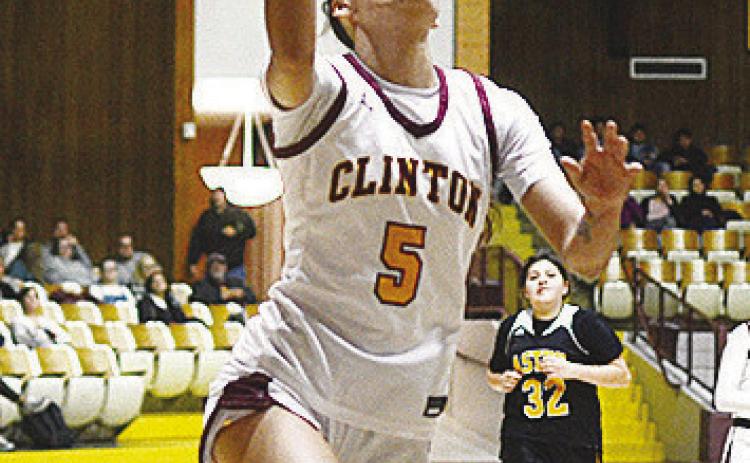 Clinton’s Lillian Lime goes up for the layup during the Lady Reds’ home win over the Astec Lady Comets. CDN | Sam Goodwyn