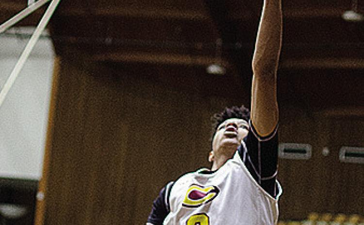 Clinton’s Titan Malone goes up for the layup during practice in the Tornado Dome. CDN | Sam Goodwyn