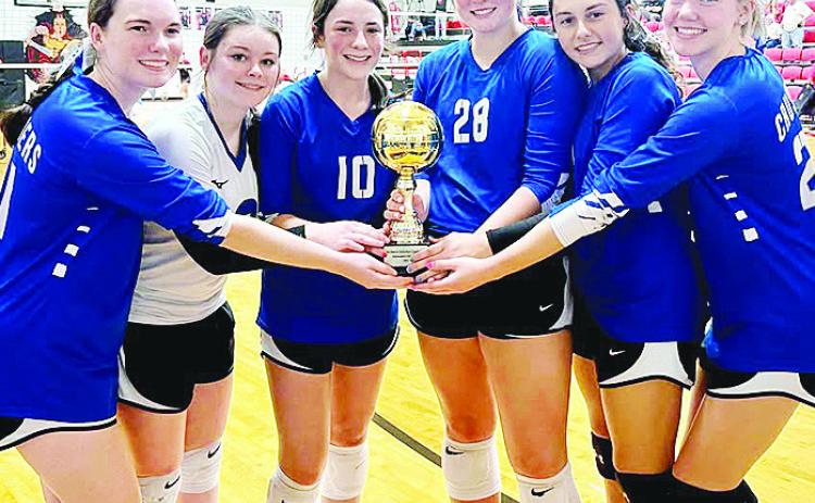 The Corn Bible Academy Lady Crusaders volleyball team was crowned the first winners of the Northwest Volleyball Conference Tournament, which was hosted by Oklahoma Bible Academy Saturday in Enid. Pictured, from left, are Cami Moran, Alayna Floyd, Claire L