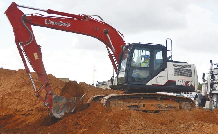 Moving loads of red dirt