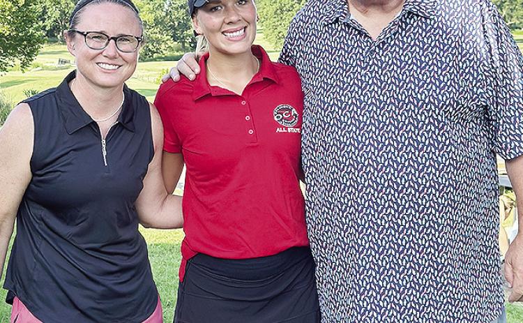Grace Meacham, center, celebrates her All-State appearance Monday at Cherokee Hills Golf Club in Catoosa with current Clinton Lady Reds’ Golf Coach Tasha Marshall, left, and former golf coach Mike Lee. CDN | Courtesy Photo