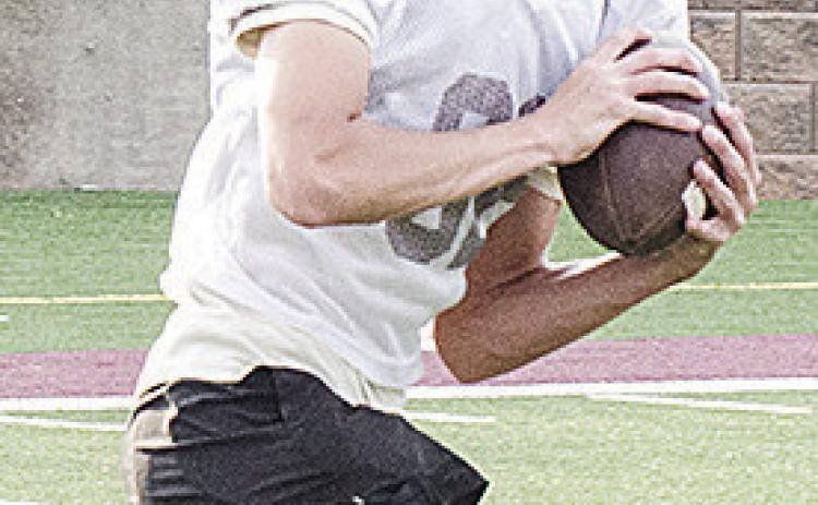 Clinton’s Judd Hall cuts upfield after catching the ball during spring practice in the Tornado Bowl. CDN | Sam Goodwyn