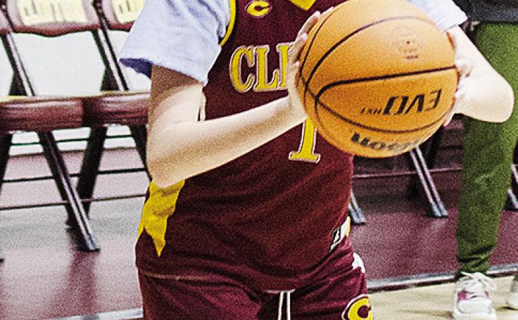 Clinton’s Quincy Matlock squares up to shoot the ball during practice in the Tornado Dome. CDN |Sam Goodwyn