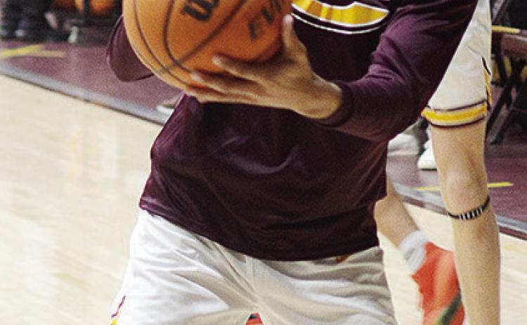 Senior Kyler Ringo-Kabunda shoots the ball prior to Clinton taking on Elk City. CDN | Sam Goodwyn
