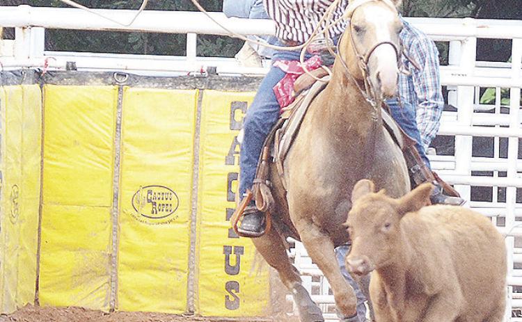 El Reno’s Rachel Ellis blasts out the gate in last year’s rodeo as she participates in the breakaway roping event at the Clinton Rodeo Arena. CDN | Sam Goodwyn
