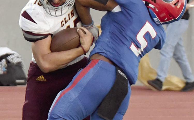 Reds win first district game