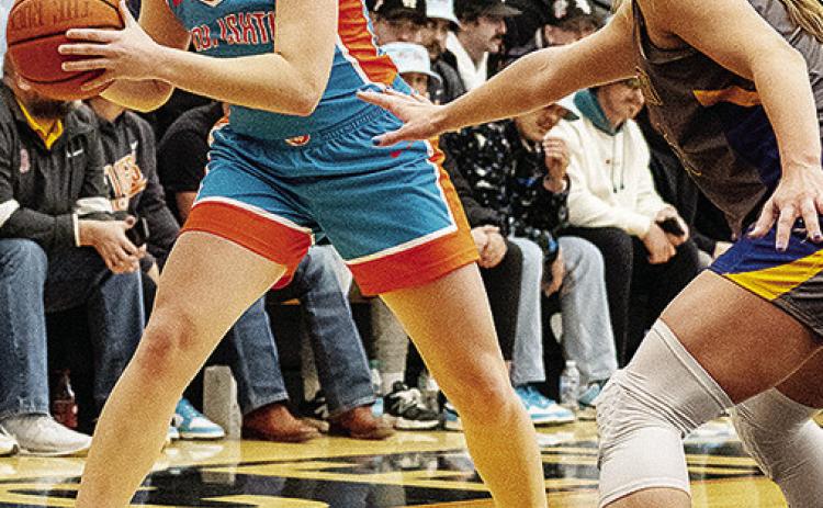 Former Arapaho-Butler Lady Indian Katie Edelen looks for an open teammate during an East Central game this season. CDN | Courtesy Photo