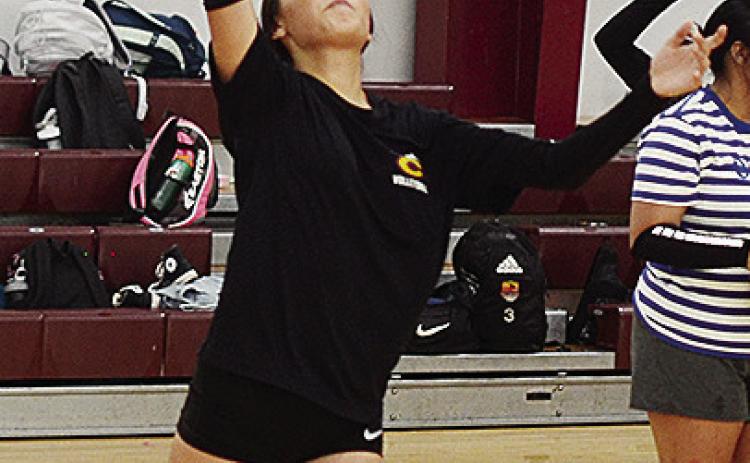 CDN | Sam Goodwyn Clinton’s Evelyn Aispuro focuses on the ball as she prepares to serve it over the net during practice.