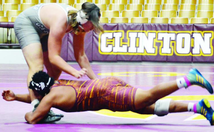 linton 215-pounder Malachi Lorne shoots in on the low single-leg to register a takedown against his Kingfisher opponent