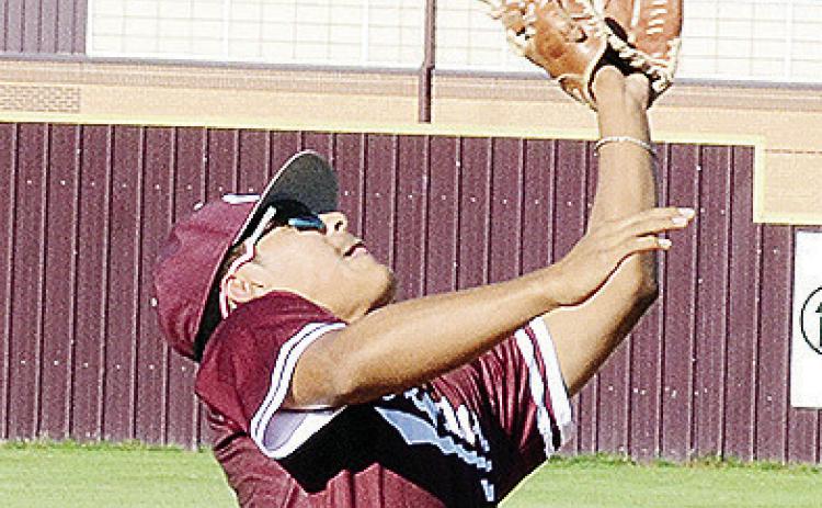 Clinton’s Jesus Gutierrez focuses on the ball as he goes to catch the pop fly during the Reds’ game against Weatherford. CDN | Sam Goodwyn