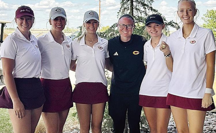 The Clinton Lady Reds golf team is all smiles after it clinched a spot in the Class 4A State Tournament. Pictured, from left, are Paige Pugh, Grace Meacham, Addison Newcomb, Coach Tasha Marshall, Rylee Cummins and Addyson Littke. CDN | Courtesy photo