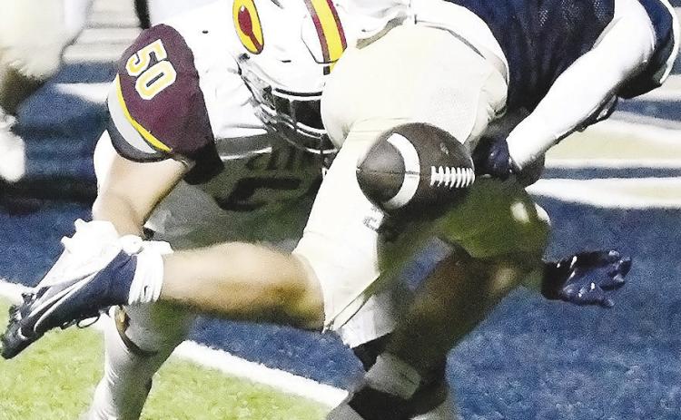 Clinton’s No. 50 Alex Amaya forces a fumble at the goal line during the Red Tornadoes’ road loss Friday to Kingfisher. CDN | John Kinsey