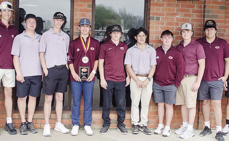 The Clinton boys’ golf team smiles after finishing the high school tournament Wednesday at Riverside Golf Course. Pictured, from left, are Coach Brent Caldwell, Conner Meget, Caber Johnson, Landyn Kunsman, Scout Acosta, Sy Foster, Sutton Hernandez, Rayd