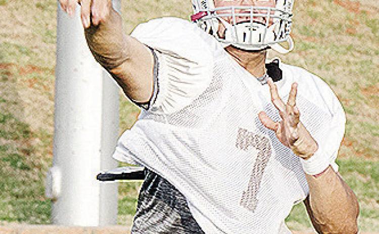 No. 7 Easten Powell throws the ball during a drill in the middle of practice Monday at the Tornado Bowl. CDN | Sam Goodwyn