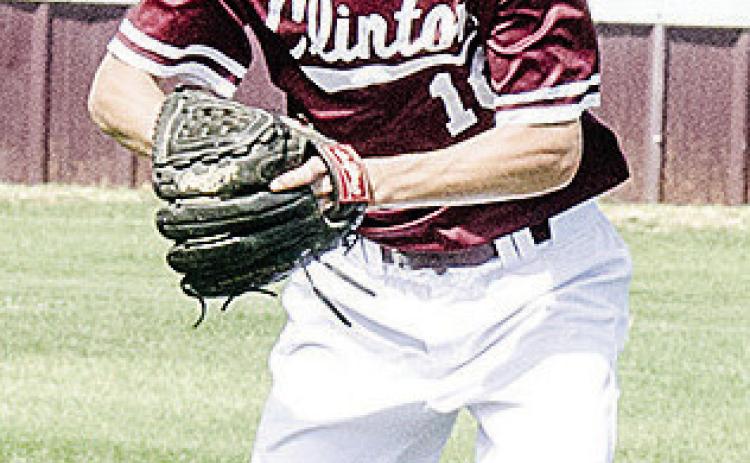 Clinton’s Snider Dowdell grabs the ball as he prepares to throw it during the Reds’ home spring game against Elk City. CDN | Sam Goodwyn