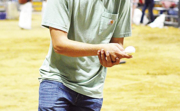 Clinton’s Ben Christie focuses on his egg during the Custer County Free Fair Farmhand Olympics egg race. CDN | Micah Ashcraft