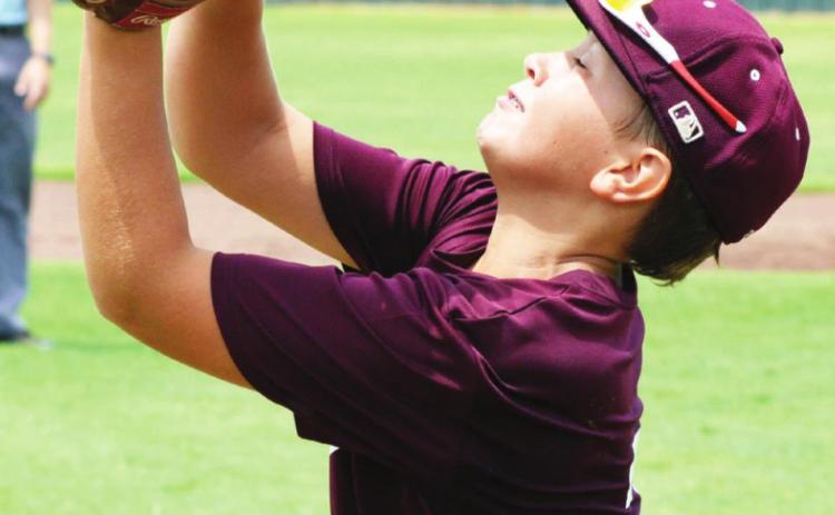 Reds claim win at state tourney