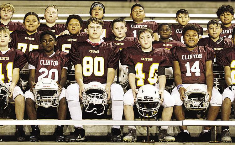 The Maroon Team is focused as it takes a team photo prior to winning the inaugural Bryant Calip Championship game. Pictured in front, from left, are Keaston Fieselman, Cordae James, Jance Baker, Lyrik Hunter, Tru Randle, and Malachi Ford; middle row, Luka