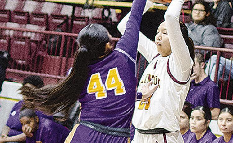 Clinton’s Ella Redshin looks for an open teammate during the Lady Reds’ game against Anadarko in the Tornado Dome. CDN | Sam Goodwyn