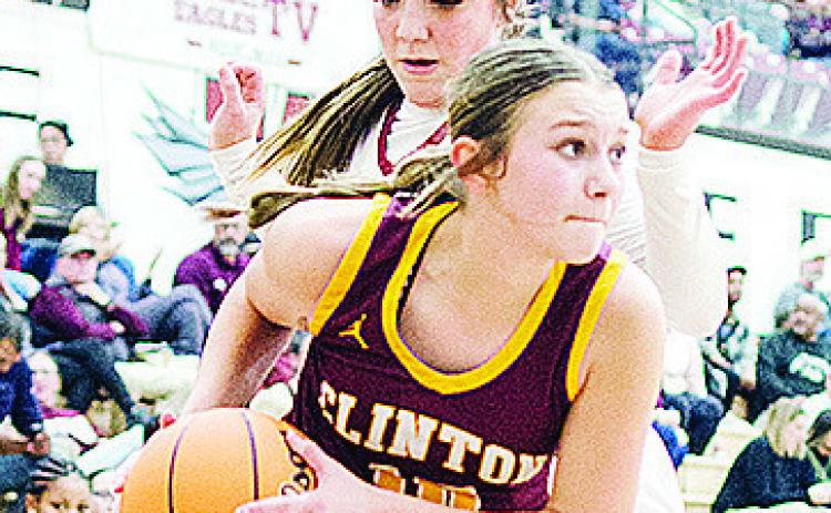 Clinton’s Hadley Meget fights through a Weatherford defender this season. CDN | Sam Goodwyn