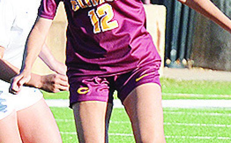 No. 12 Maddi McAtee outraces a Newcastle defender to the ball during Clinton’s win over the Lady Racers. CDN | Sam Goodwyn