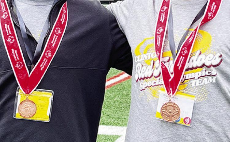 Clinton’s Sutton Hernandez, left, and Bryson Miles are all smiles after winning bronze in the Unified Boccee Ball event during the State Special Olympics at Oklahoma State. CDN |Courtesy Photo